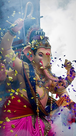 Vibrant Ganesha Festival Idol Adorned in Colorful Saree with Confetti and Smoke HD phone wallpaper