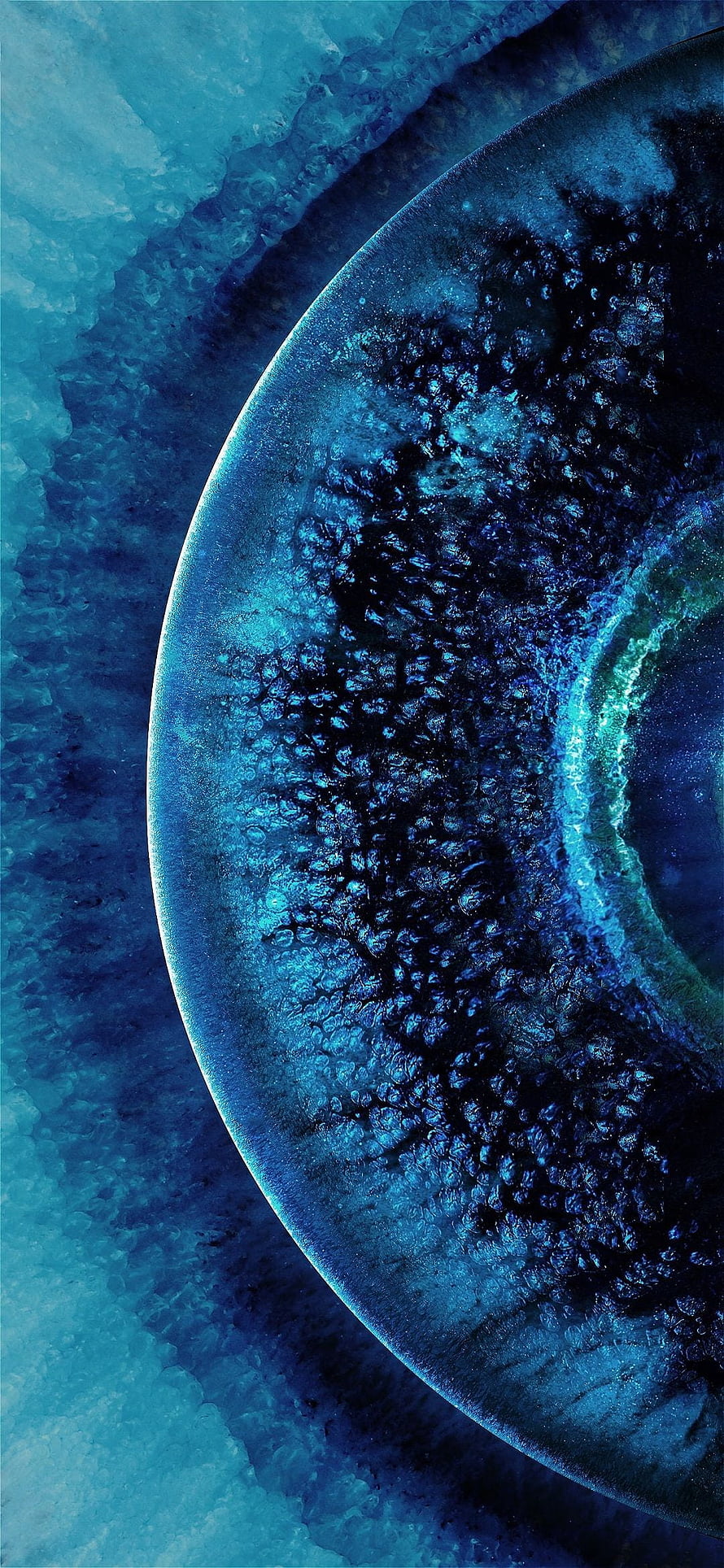 Abstract Blue Planet Surface With Glowing Rim And Textured Craters HD phone wallpaper