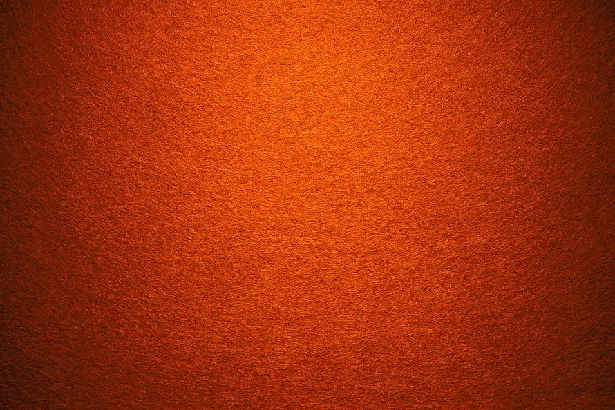 Warm Orange Carpet Texture with Soft Lighting and Subtle Grain HD wallpaper