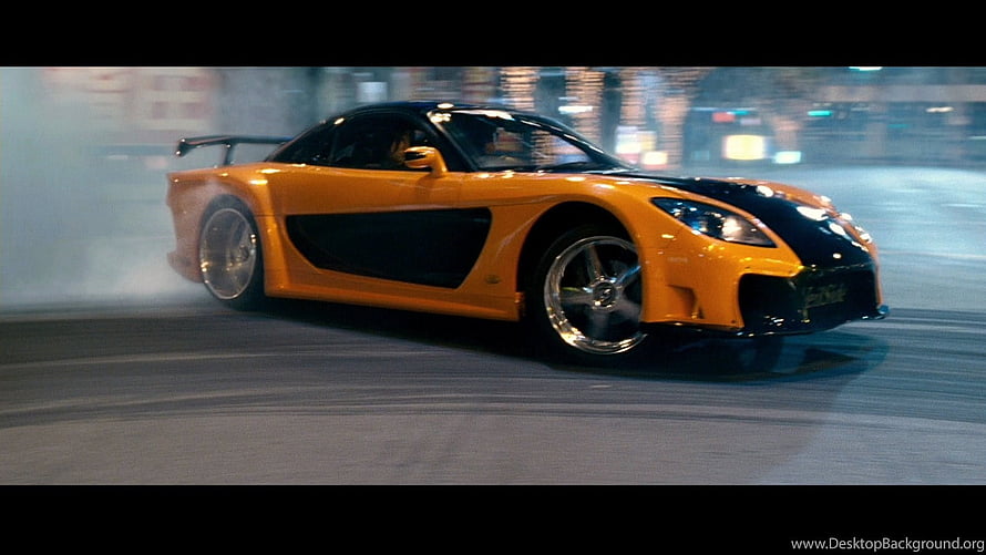 Mazda RX-7 drifting through a neon-lit city street at night in Fast and Furious Tokyo Drift HD wallpaper