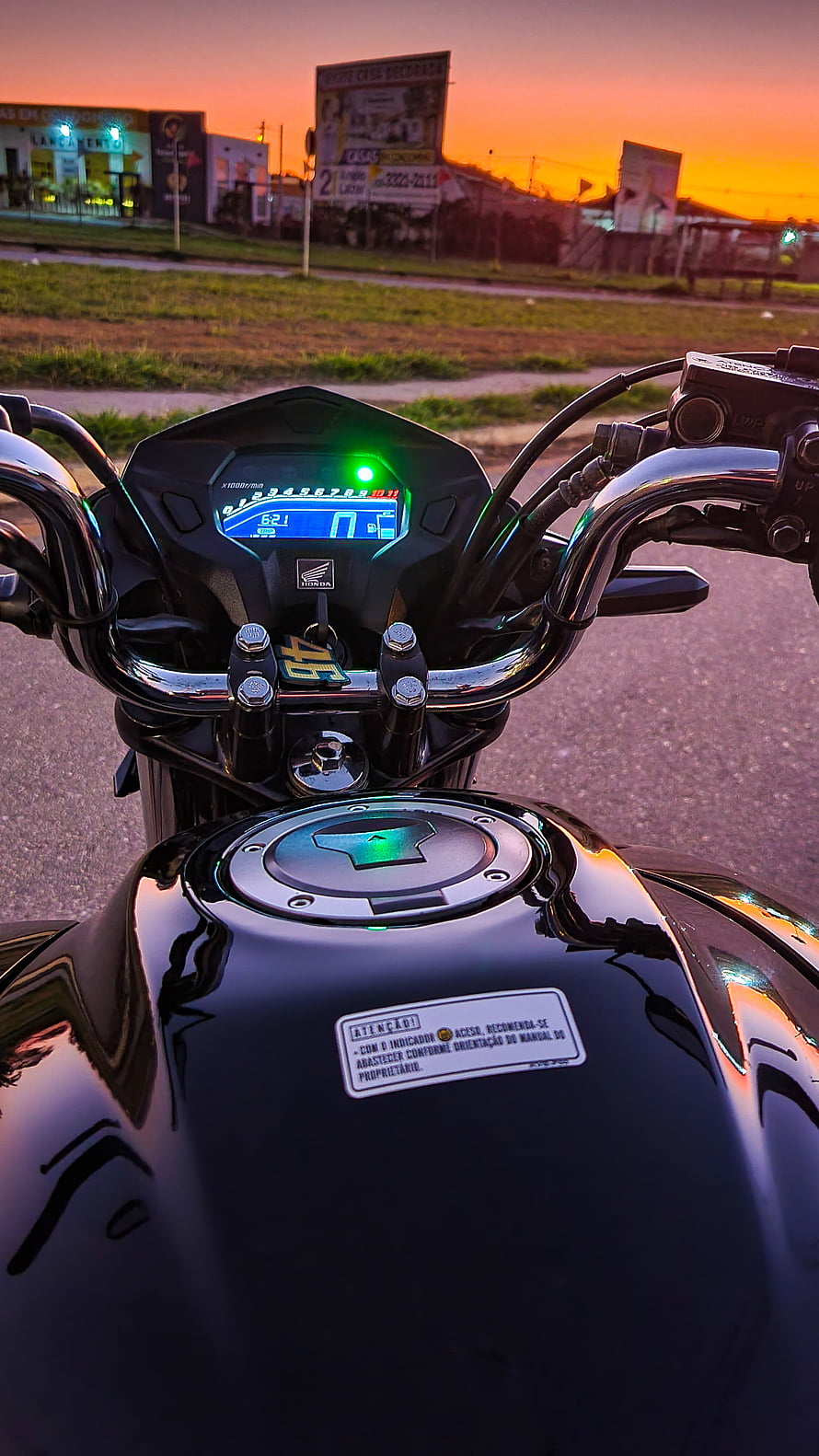Honda motorcycle dashboard and fuel tank at sunset with digital display and chrome handlebars HD phone wallpaper