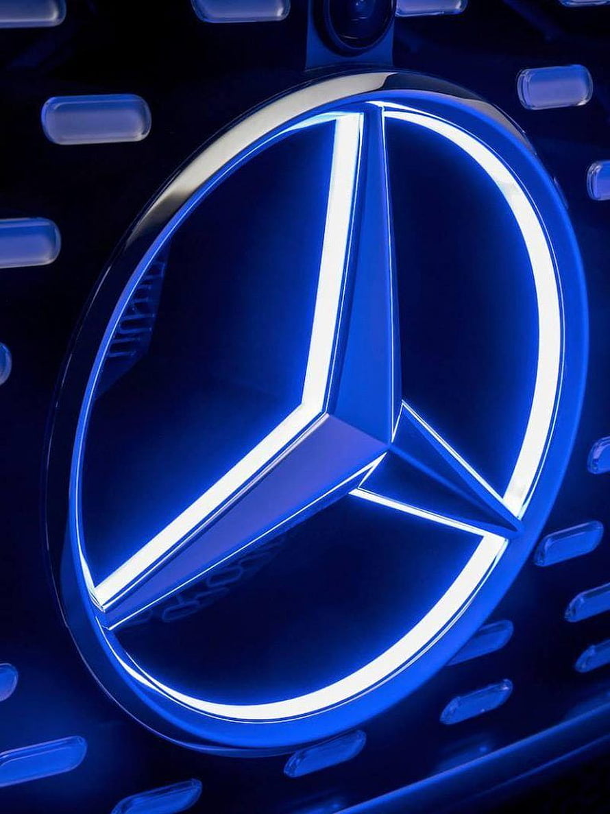Illuminated Mercedes-Benz Three-Pointed Star Emblem on Blue Grille HD phone wallpaper