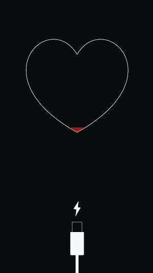 Minimalist Heart Battery Charging Icon With Lightning Bolt On Black Background HD phone wallpaper