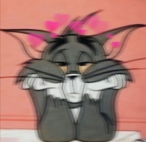 Tom Cat from Tom and Jerry Blushing with Hearts Floating Above His Head HD wallpaper