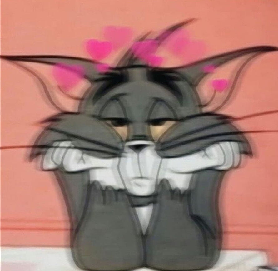 Tom Cat from Tom and Jerry Blushing with Hearts Floating Above His Head HD wallpaper