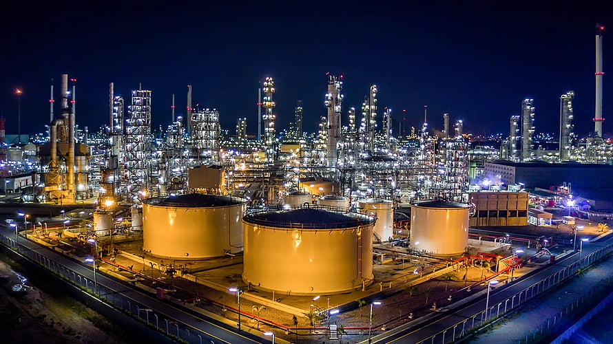 Illuminated Petrochemical Plant at Night with Storage Tanks and Distillation Columns HD wallpaper