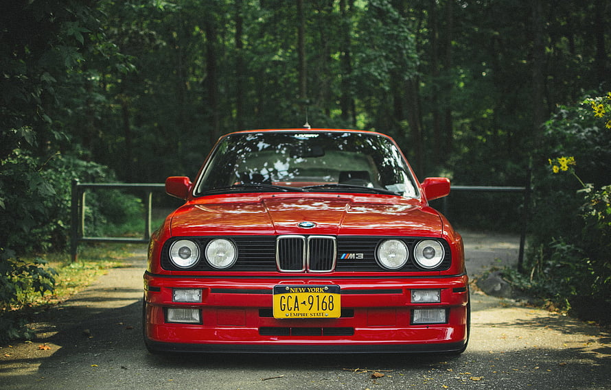 Classic Red BMW M3 E30 Front View Parked on a Forest Road HD wallpaper