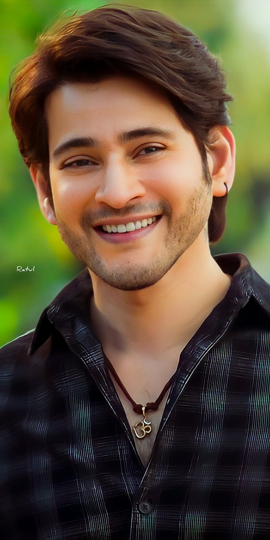 Mahesh Babu smiling portrait wearing a black shirt and om pendant necklace HD phone wallpaper