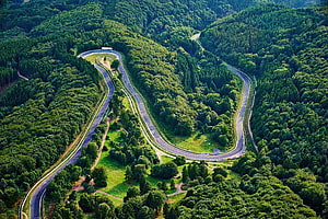 Aerial View of the Nordschleife at Nurburgring Winding Through Dense Forest HD wallpaper