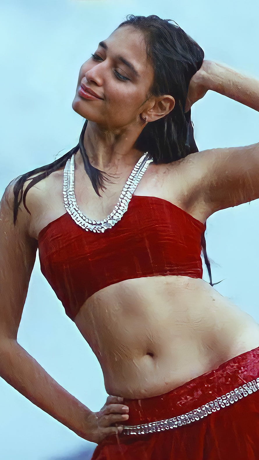 Tamanna Bhatia in a red traditional outfit with silver jewelry against a clear sky HD phone wallpaper