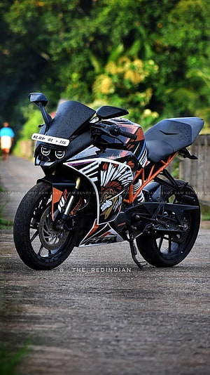 KTM RC 390 Sport Bike with Custom Graphic Wrap on a Scenic Road HD phone wallpaper