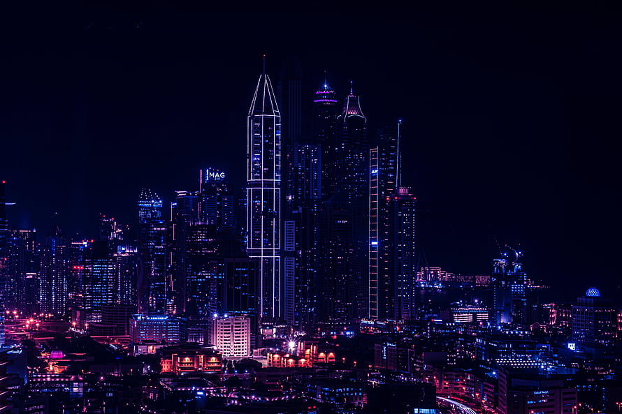 Macau skyline at night with illuminated skyscrapers and neon city lights HD wallpaper