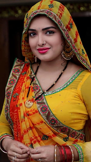 Beautiful Indian Woman in Vibrant Yellow and Orange Traditional Saree with Gold Jewelry, Amarapalli Dubey, bhojpuri actress, traditional HD phone wallpaper