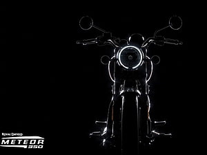 Royal Enfield Meteor 350 Front Headlight and Handlebar Detail in Dark Studio Setting HD wallpaper