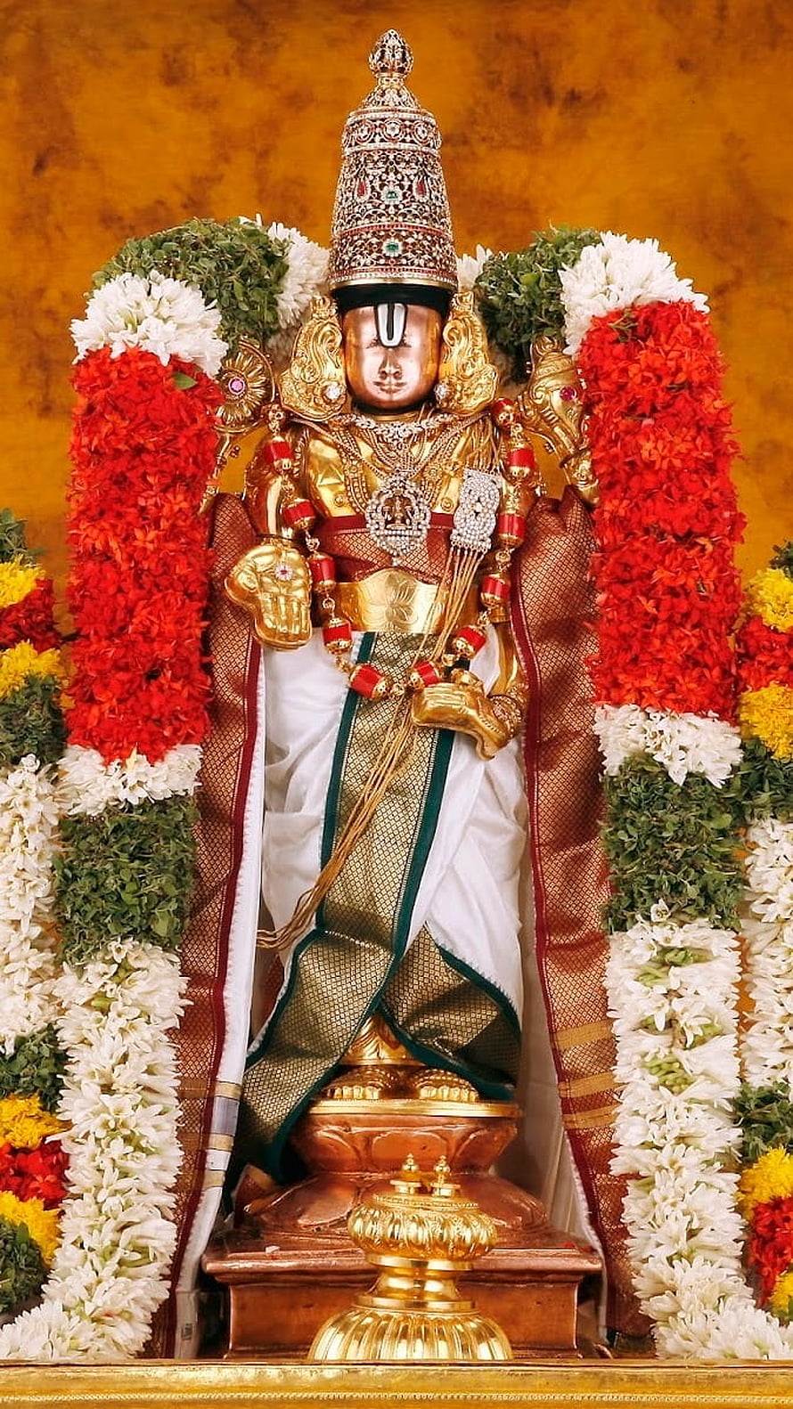 Golden Ayyappan Statue Adorned With Red And White Flower Garlands HD phone wallpaper