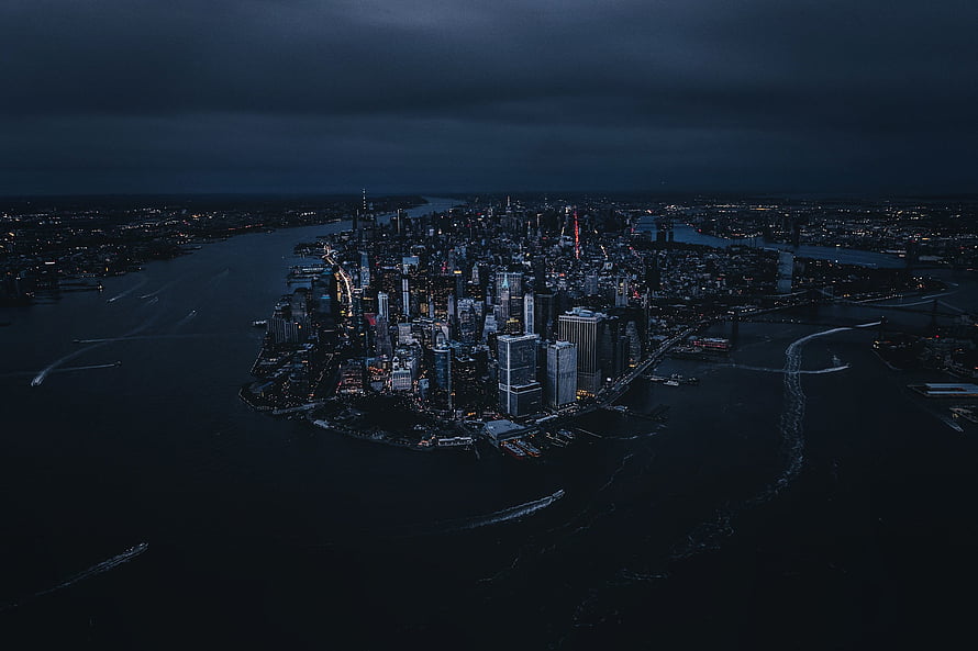 Aerial View of Manhattan Skyline at Night with Dark Cloudy Sky and City Lights, New york, city, aerial view, night, buildings HD wallpaper
