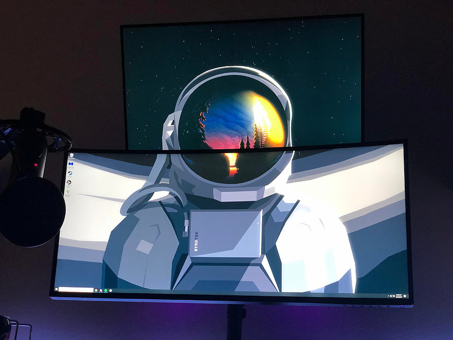 Astronaut Helmet Reflection Wallpaper on Dual Stacked Monitors Setup HD wallpaper