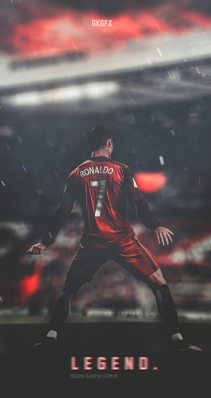 Cristiano Ronaldo in Red Manchester United Kit Standing on Rainy Football Pitch HD phone wallpaper