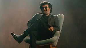 Rajinikanth in Jailer wearing sunglasses and a grey blazer seated in a modern chair HD wallpaper