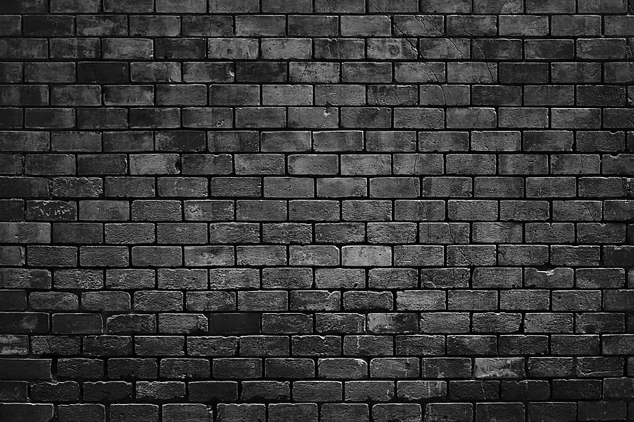 Monochrome Black Brick Wall Texture with Weathered Surface and Industrial Character HD wallpaper