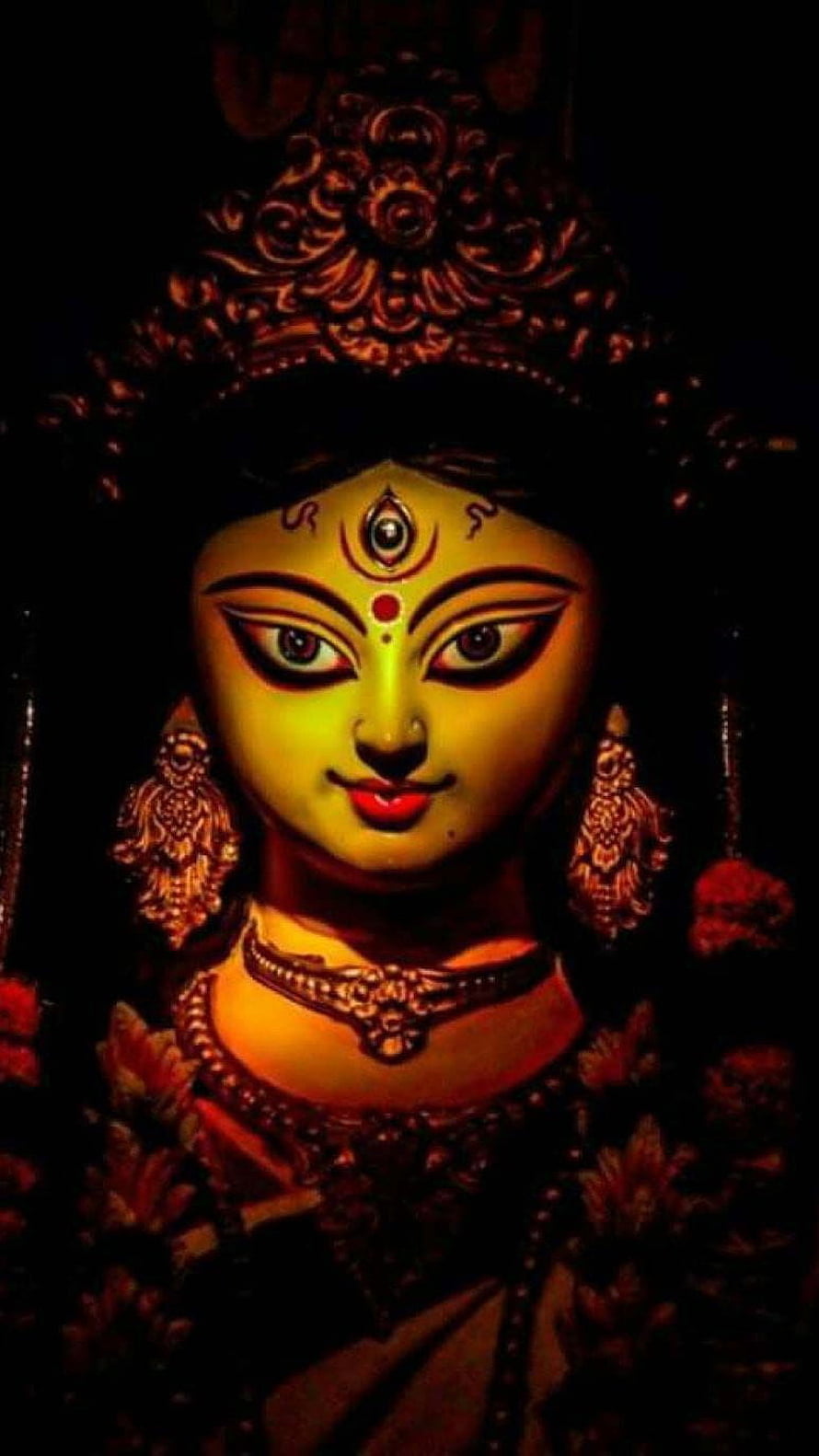 Close-up Portrait of Goddess Kali Statue with Third Eye and Traditional Jewelry HD phone wallpaper