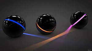 Three Glossy Black Spheres With Glowing Neon Light Bands On Dark Background HD wallpaper