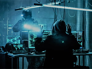 Hacker Confronted By Armed Officer In Dark Server Room With Multiple Monitors HD wallpaper