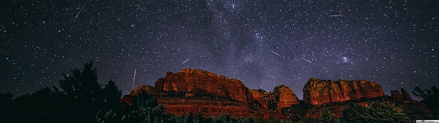 Meteor Shower Over Red Rock Canyon Under a Starry Night Sky HD wallpaper