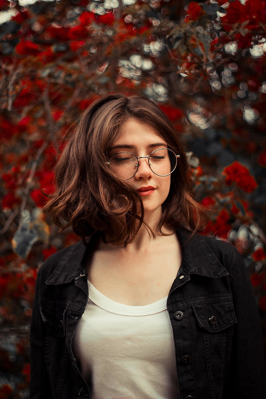 Serene Portrait of a Young Woman with Glasses Amidst Vibrant Red Foliage, Close eyes, cute, girl model HD phone wallpaper