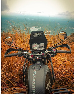 Royal Enfield Himalayan Motorcycle Parked on a Grassy Hilltop with Panoramic Valley View HD phone wallpaper