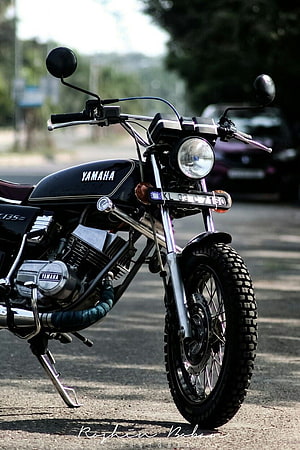 Classic Black Yamaha RX 135 Motorcycle with Chrome Details and Knobby Tires HD phone wallpaper