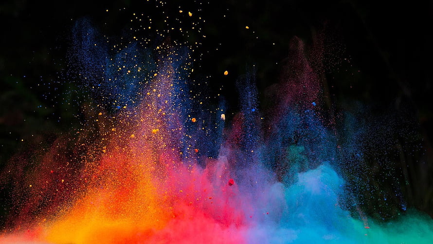 Vibrant Explosion of Multicolored Powder Dust Against Dark Background HD wallpaper