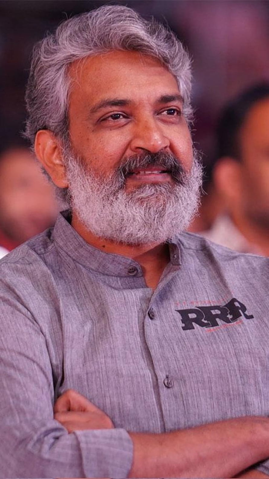 SS Rajamouli Portrait in Grey Band Collar Shirt with RRR Logo HD phone wallpaper
