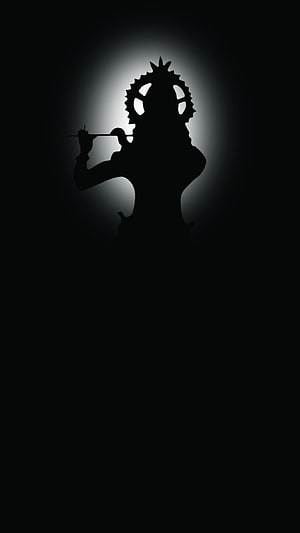 Silhouette of a character with a spiked helmet holding a flute against a glowing background HD phone wallpaper