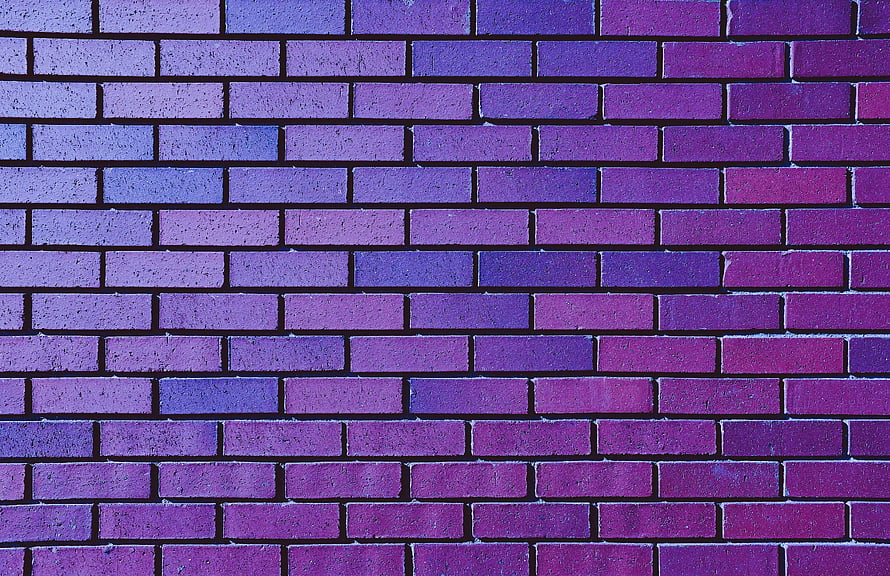 Violet and Purple Brick Wall Texture with Gradient Color Shift HD wallpaper