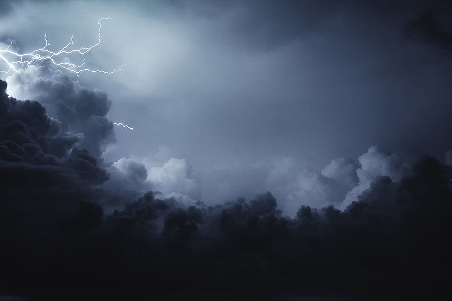 Dramatic Lightning Storm Illuminating Dark Clouds in a Thunderous Night Sky HD wallpaper