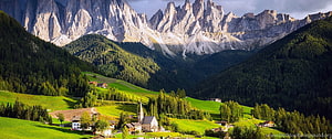 Alpine Valley Village with Church and Dramatic Dolomite Peaks HD wallpaper