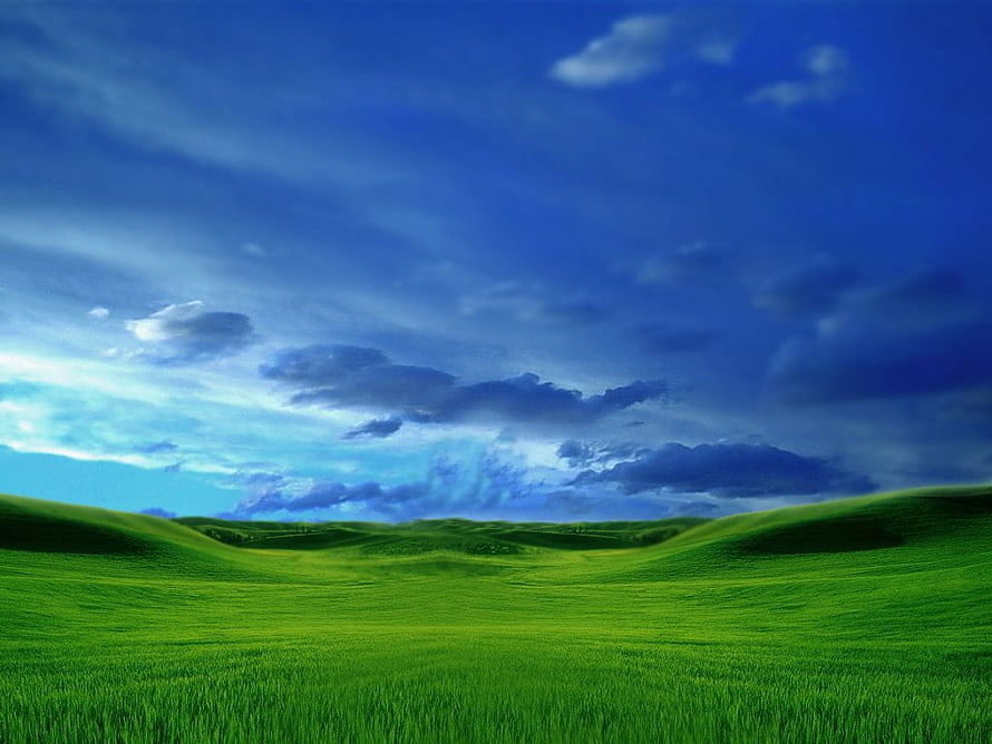 Vibrant Green Rolling Hills Under a Dramatic Blue Sky with Fluffy Clouds HD wallpaper