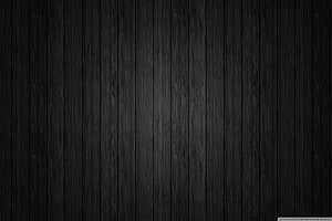 Dark Charcoal Wood Plank Texture with Vertical Grain Pattern HD wallpaper