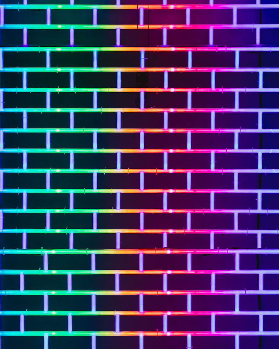 Vibrant Neon Brick Wall Pattern with Multicolored Glowing Grid Lines HD phone wallpaper