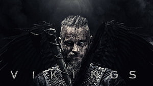 Ragnar Lothbrok from Vikings with dark wings and battle-worn face in moody cinematic portrait HD wallpaper
