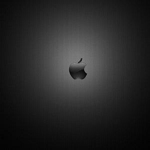 Sleek Apple Logo on Dark Textured Background with Subtle Lighting HD phone wallpaper