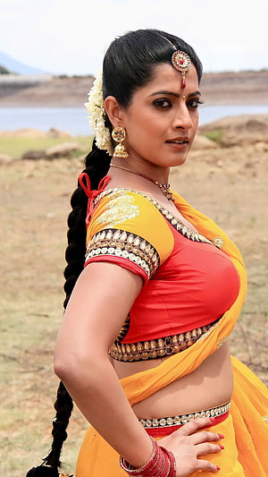 Varalakshmi in Traditional Yellow Saree with Gold Jewelry and Floral Hairpiece HD phone wallpaper