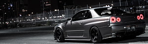 Modified Nissan Skyline GT-R R34 Night Scene with Carbon Fiber Body Kit and Rear Wing HD wallpaper