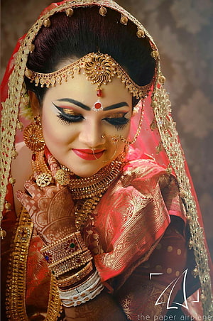 Elegant Indian Bride in Red Saree with Traditional Gold Jewelry and Intricate Henna Designs HD phone wallpaper