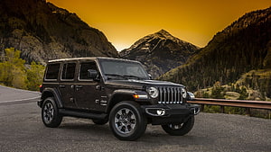 Black Jeep Wrangler Unlimited Parked on Mountain Road at Golden Hour HD wallpaper