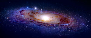 Stunning Spiral Galaxy with Glowing Core and Colorful Dust Lanes in Deep Space HD wallpaper