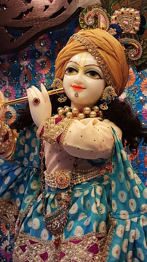 Lord Krishna Playing Flute in Blue Peacock Feather Attire HD phone wallpaper
