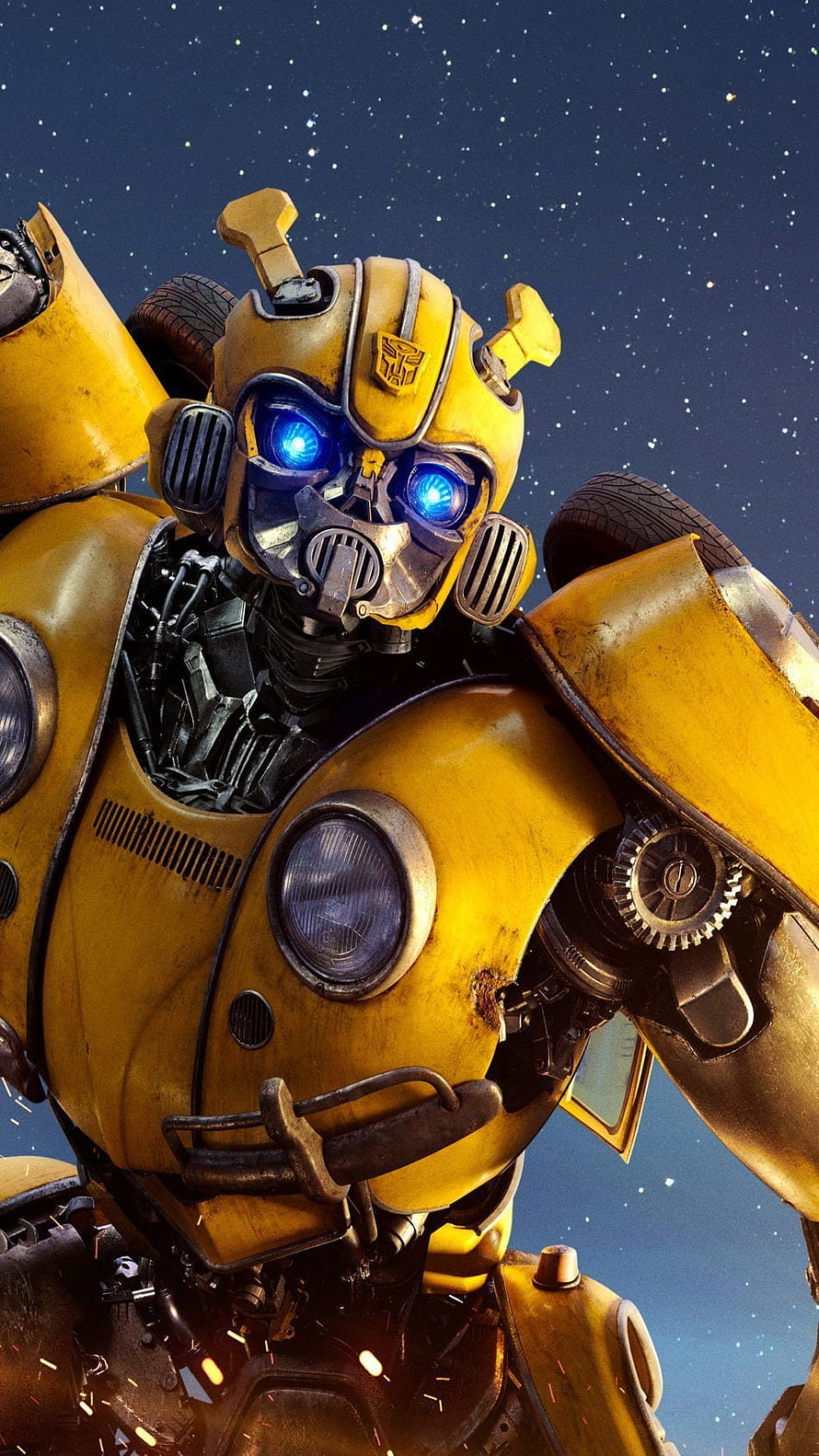 Bumblebee from Transformers: The Last Knight, glowing blue eyes and battle-worn yellow armor against a starry night sky HD phone wallpaper