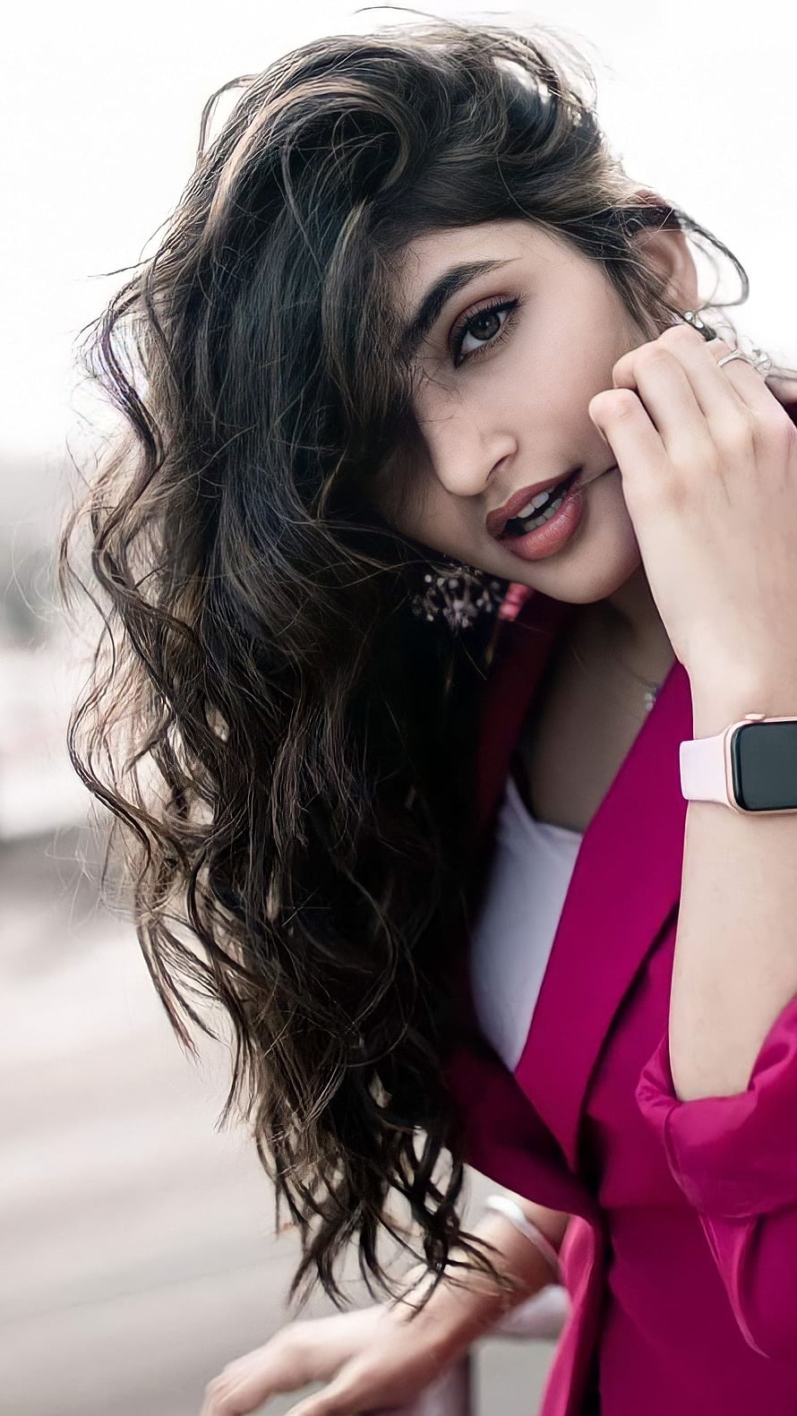 Portrait of a woman with wavy hair wearing a pink blazer and smartwatch, Sreeleela, kannada actress HD phone wallpaper